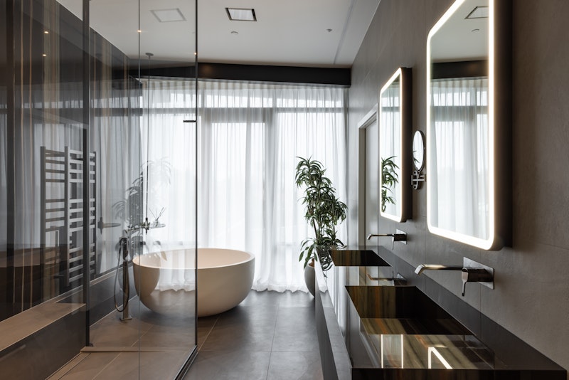 Contemporary New Zealand bathroom with twin vanities